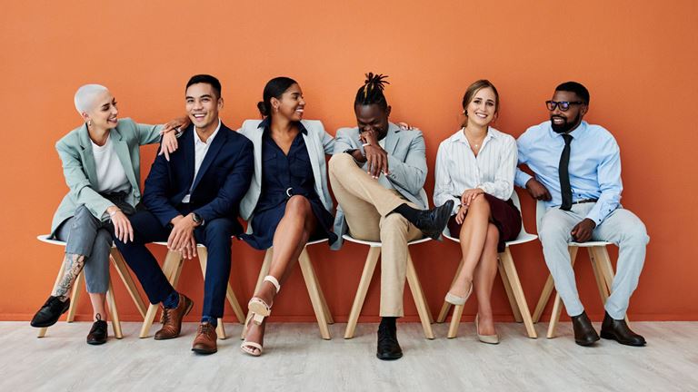 Group of people sitting in a row