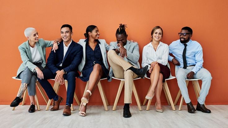 Group of people sitting in a row