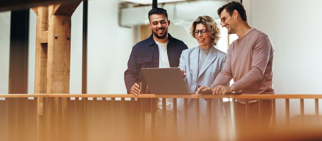 People standing at desk working