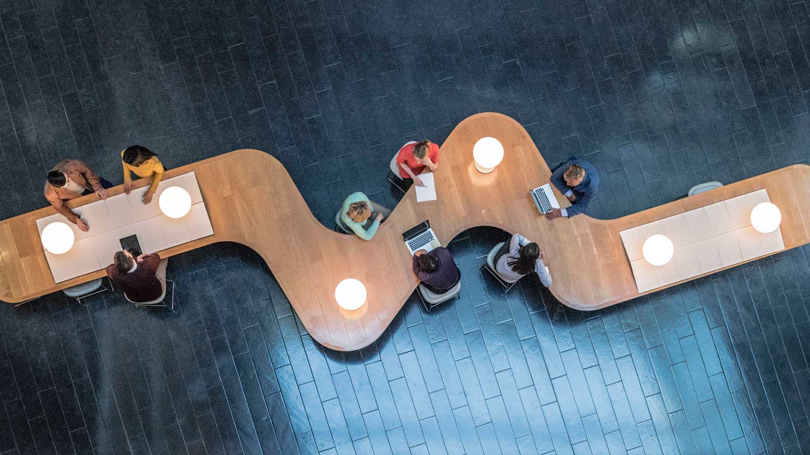 Aerial view of people working at a table