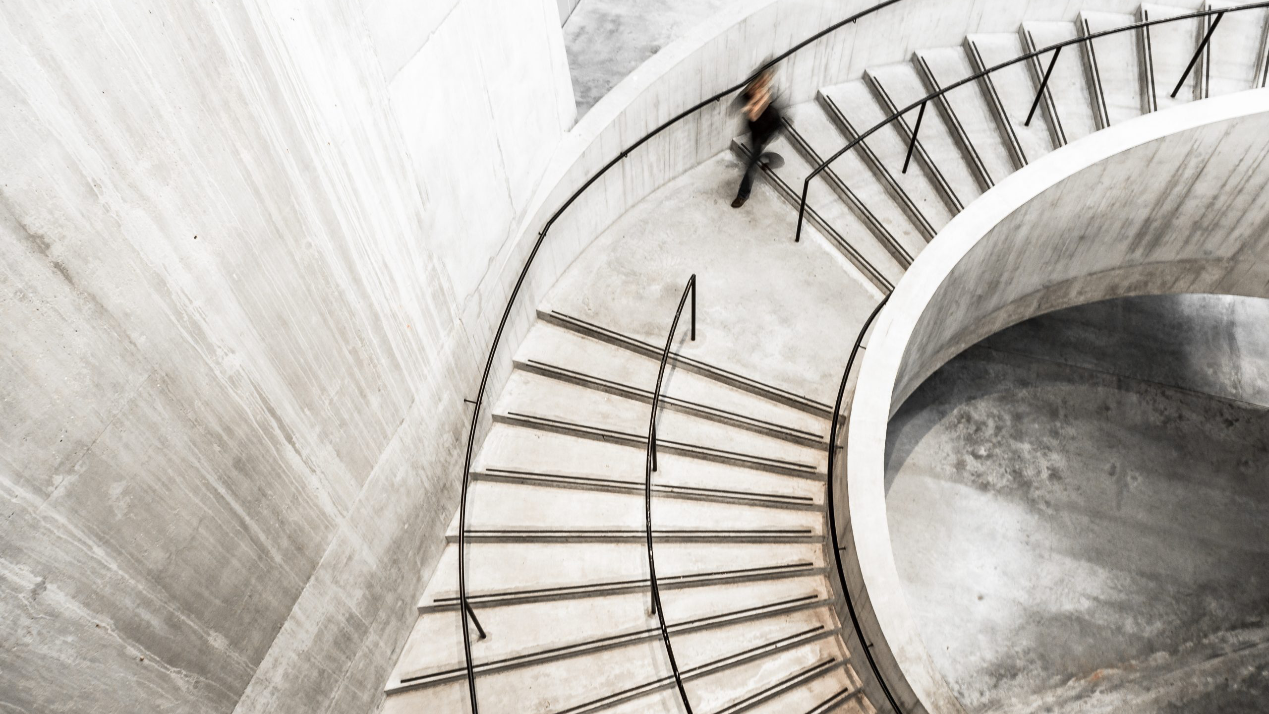 aerial view of woman walking in a stairway