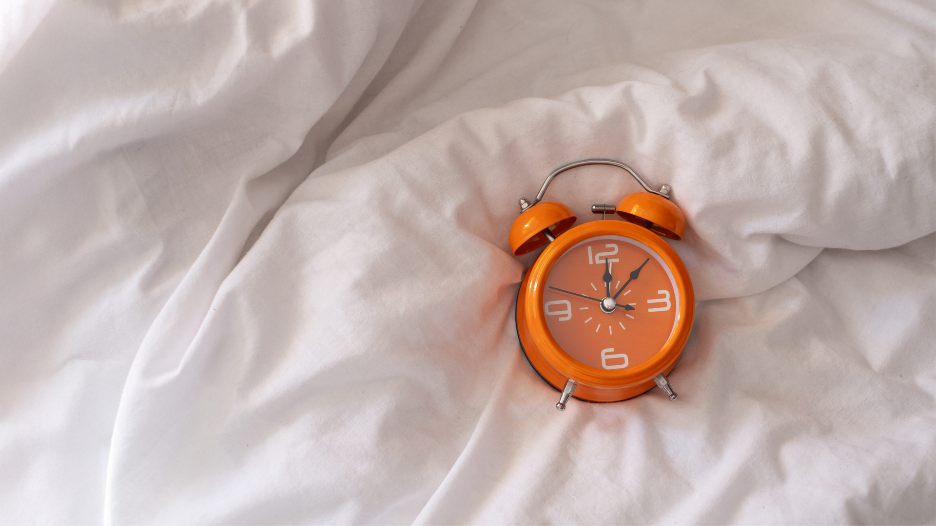 Alarm clock on sheet