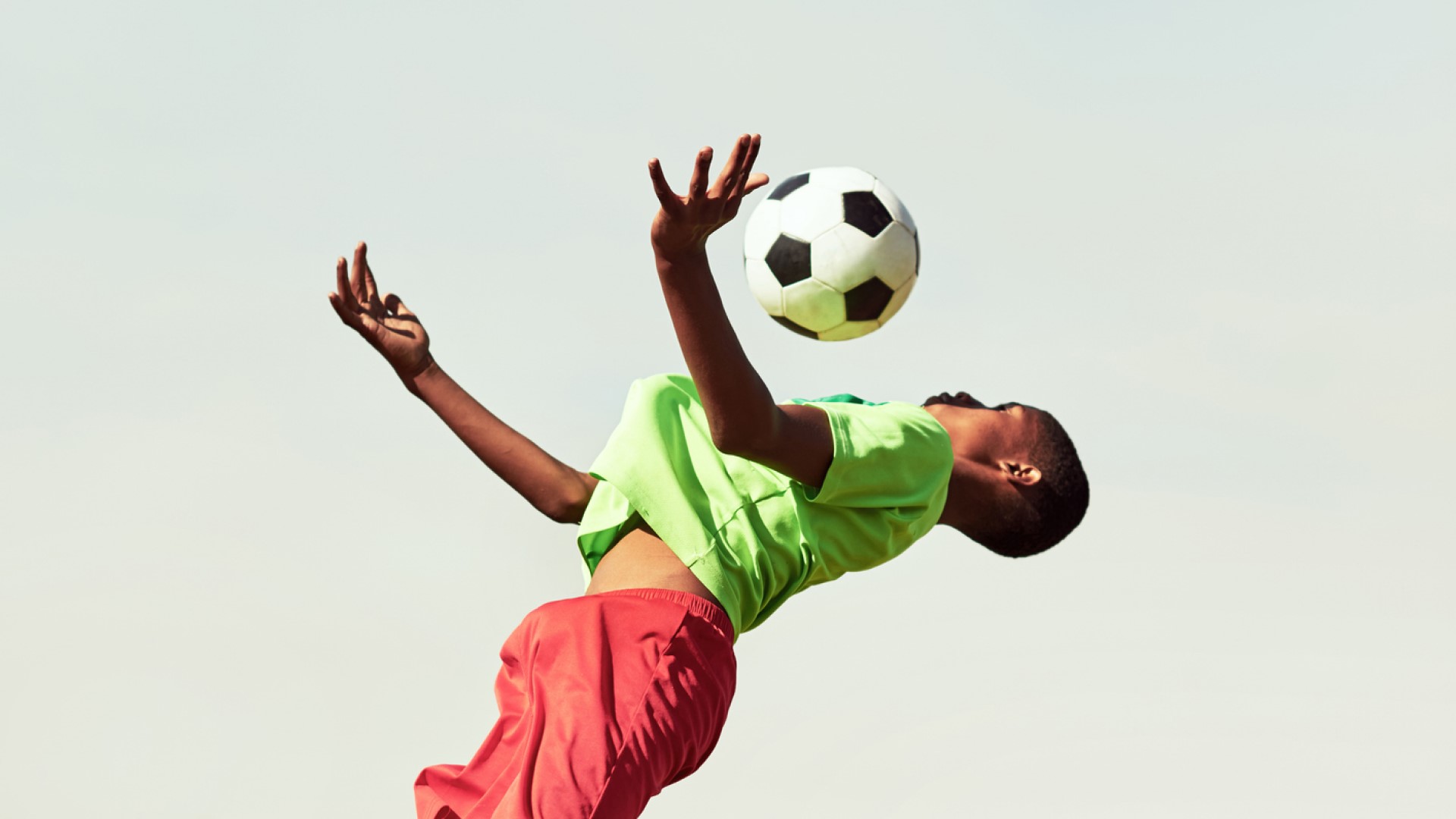 boy playing football