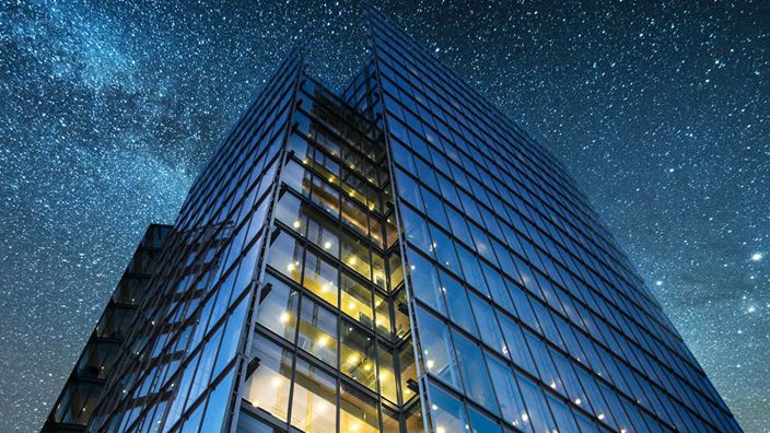 building at night time starry sky