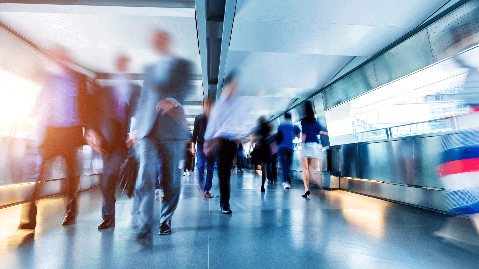 business-people-walking-through-station