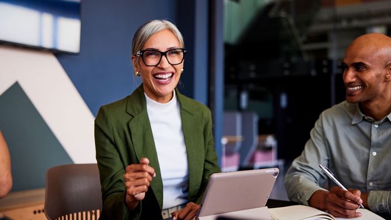 businesswoman-smiling-in-a-meeting
