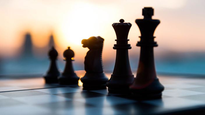Chess pieces sunset