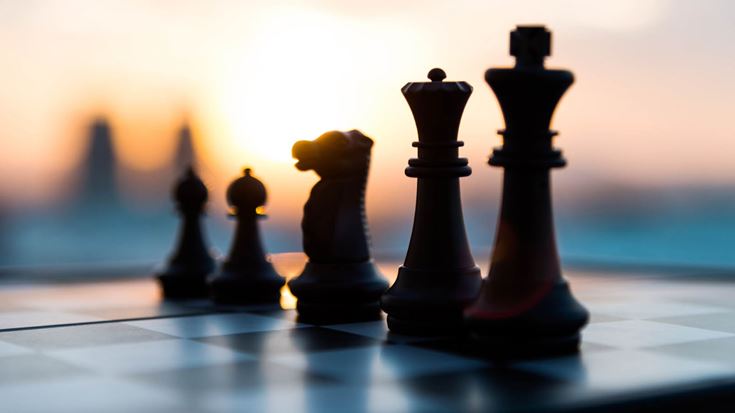 Chess pieces sunset