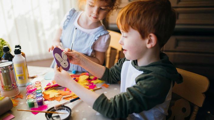 Child painting rabbit