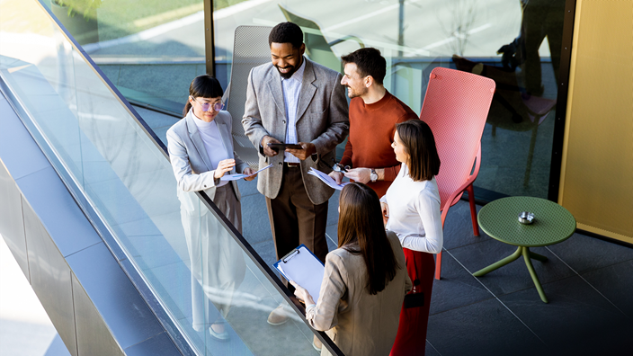 Companies and people talking in office