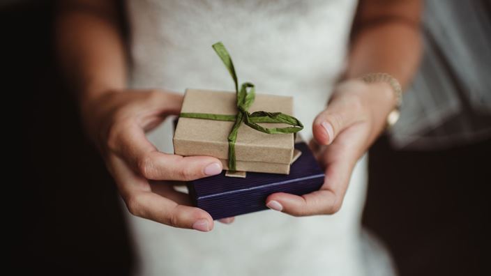 couple holding small boxes