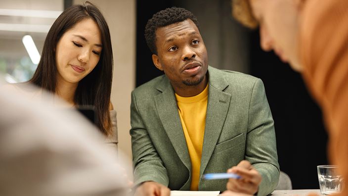 diverse people having meeting