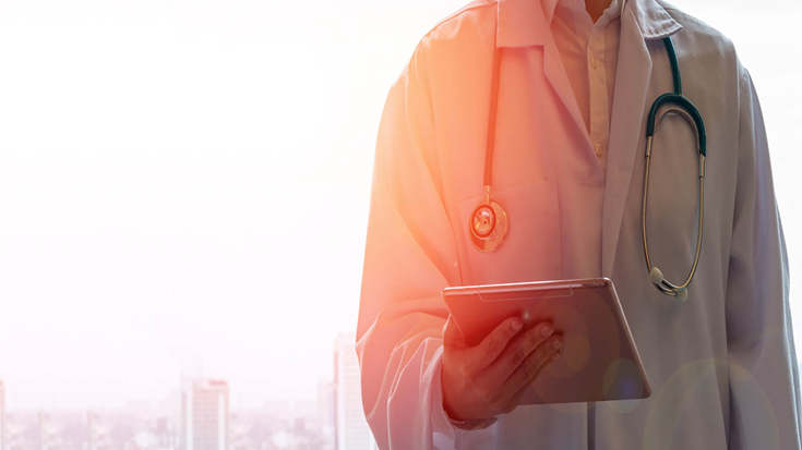 doctor with tablet