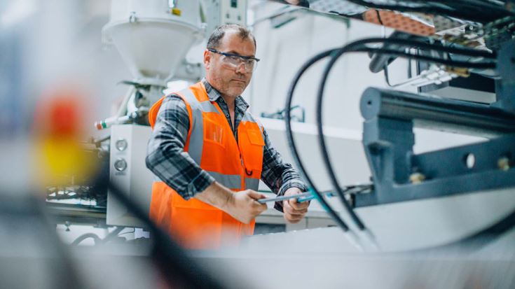 Factory worker in high vis