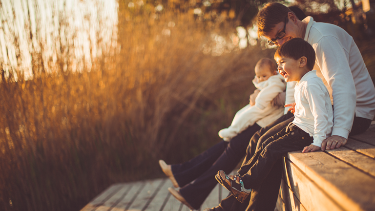 Family sitting on decking