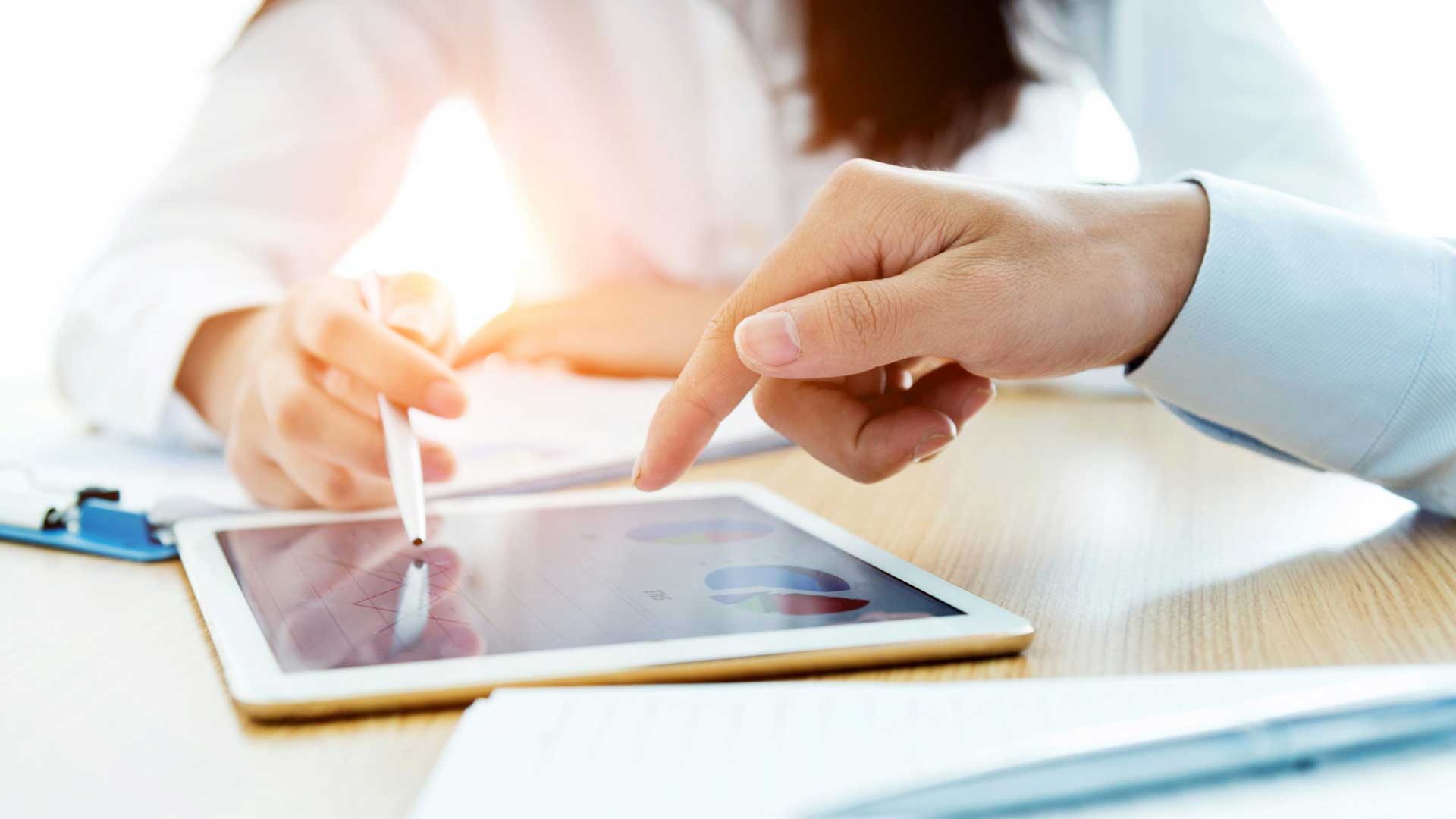 Finger pen woman working ipad tablet