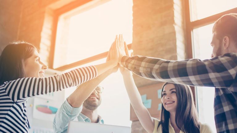 Group-of-people-Hands-together-in-air