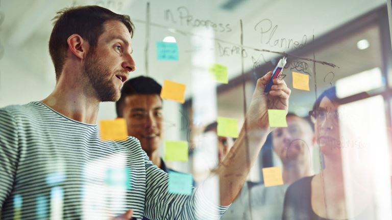 group of people with sticky notes