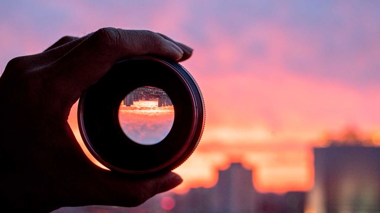 Holding camera lens