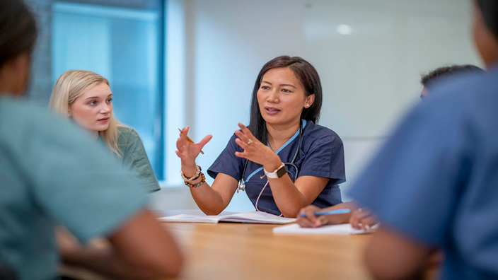 hospital nurse in a meeting