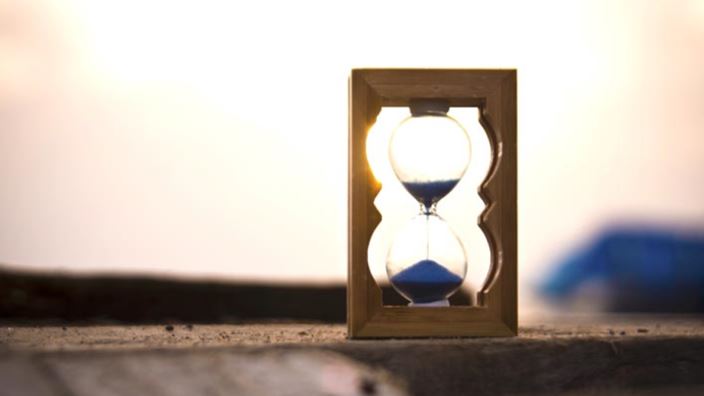 Hourglass on wood
