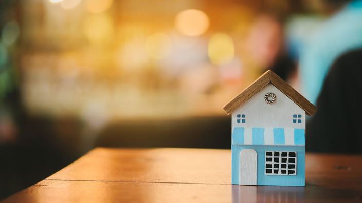 blue wooden house on desk