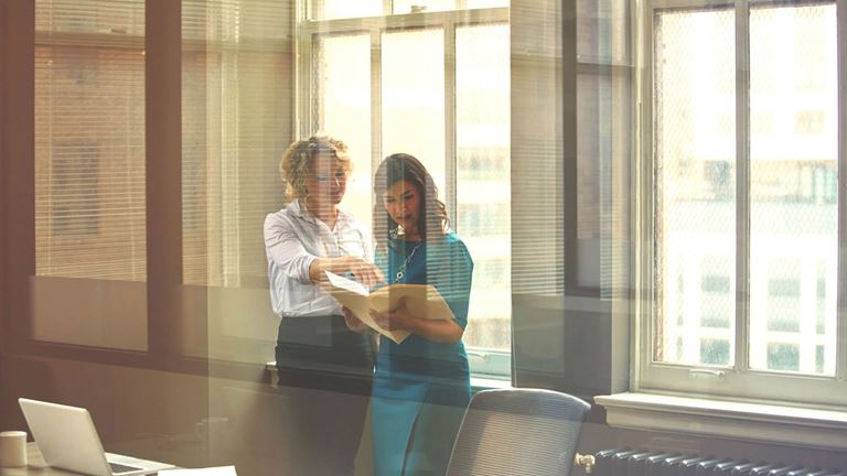 Ladies-in-office-looking-at-file
