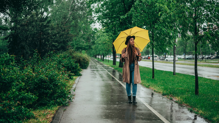Lady-walking-with-umbrella