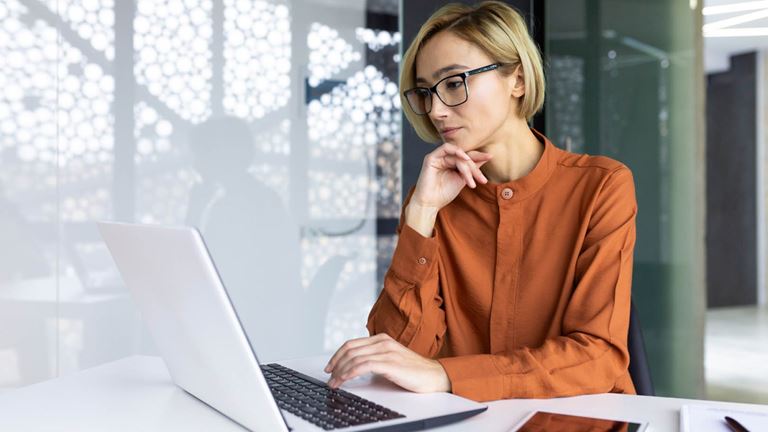 lady with laptop tablet and notepad