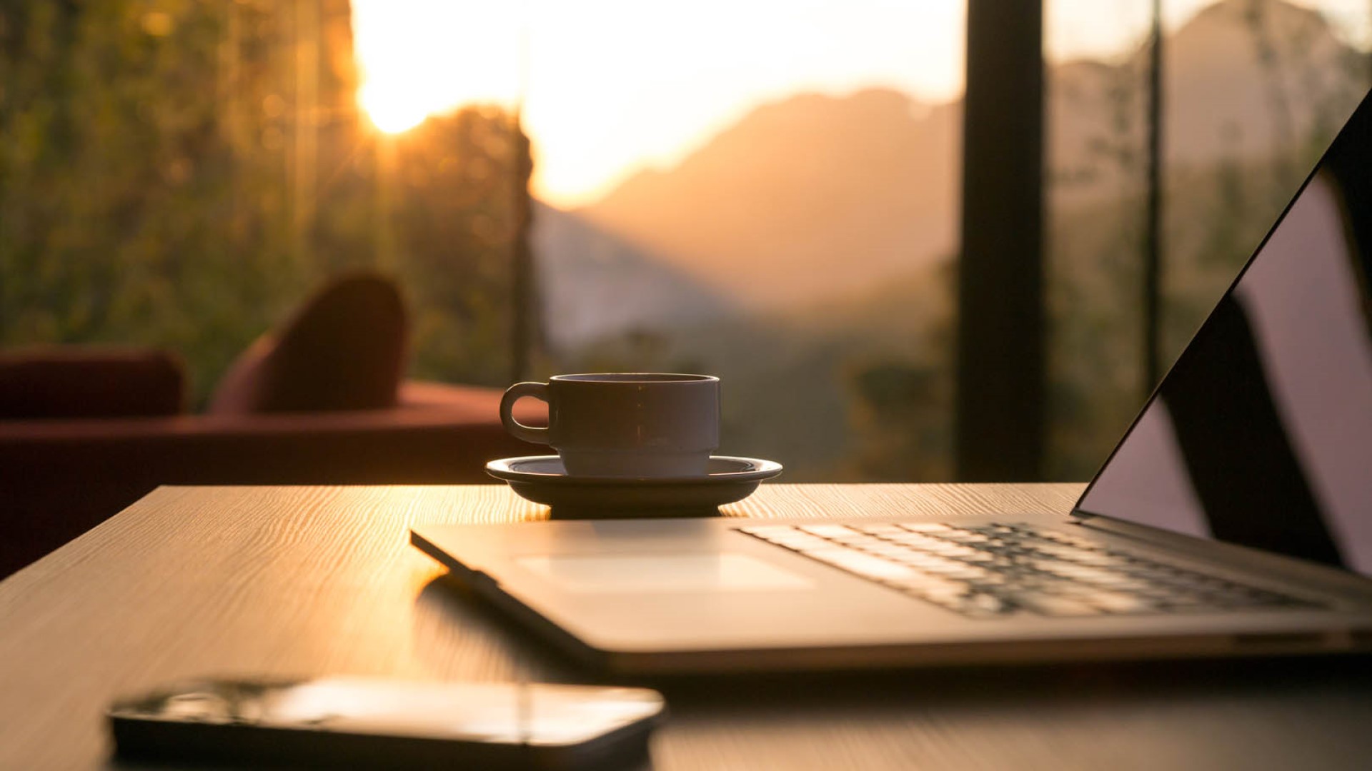 Laptop and cup on desk