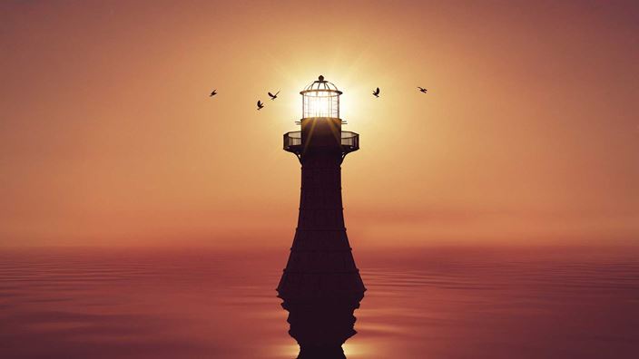 Lighthouse silhouette sunset