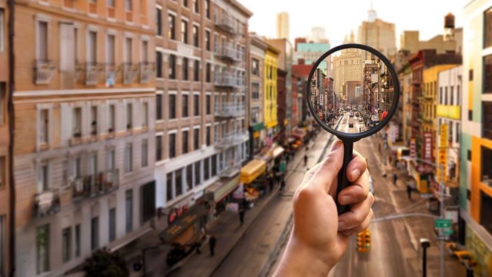 magnify-glass-on-city-road