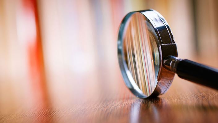 magnify glass on desk