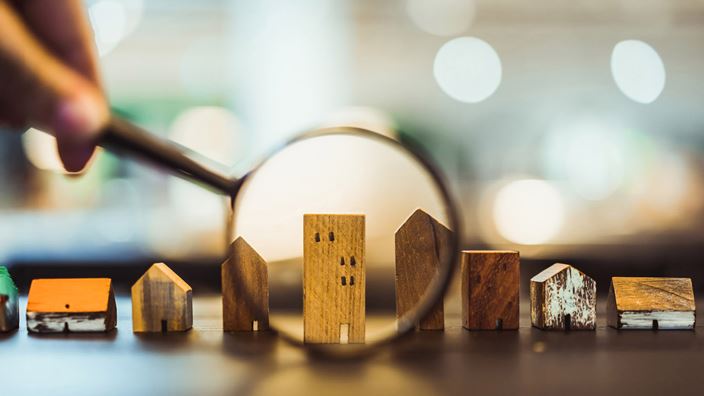 magnifying wooden house