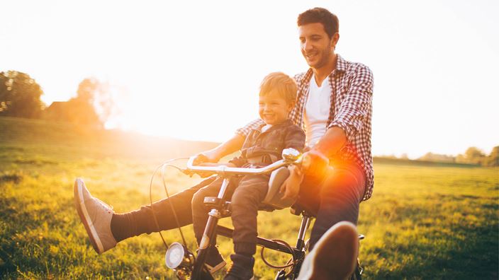 Man and small child outside