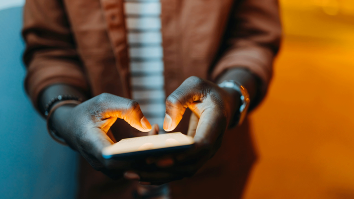 man-holding-phone-in-his-hands