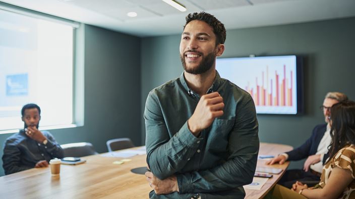 man in a office room meeting