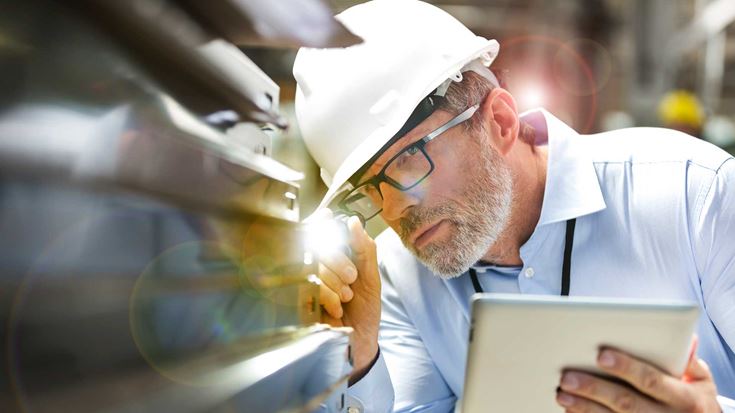 Man inspecting machinery