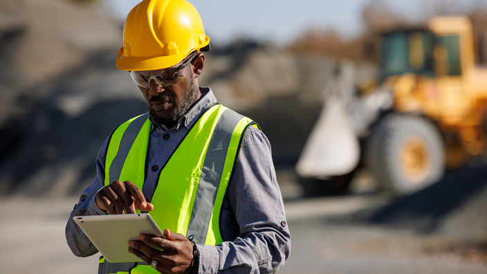 Man looking at clipboard