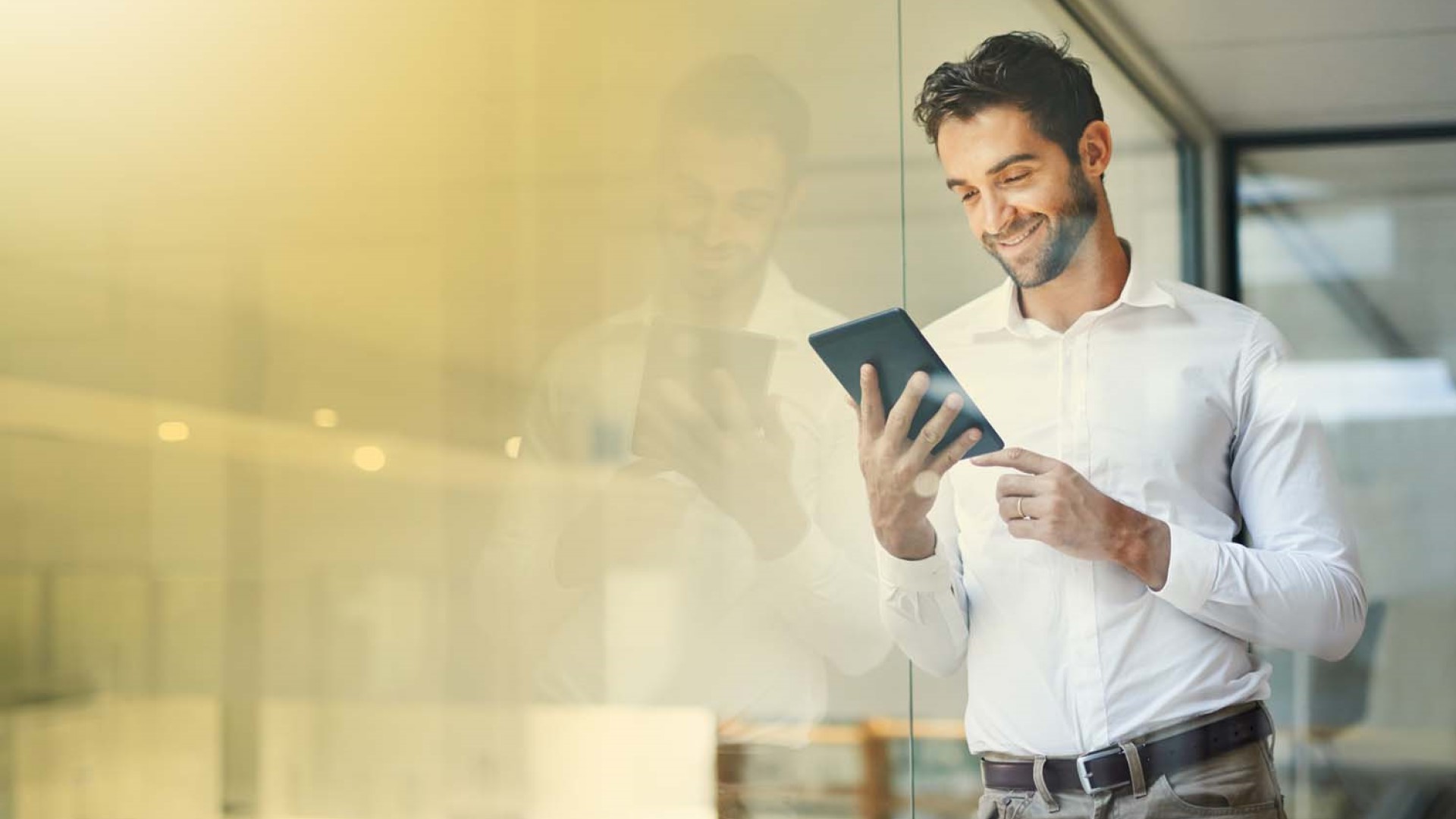 man looking at tablet