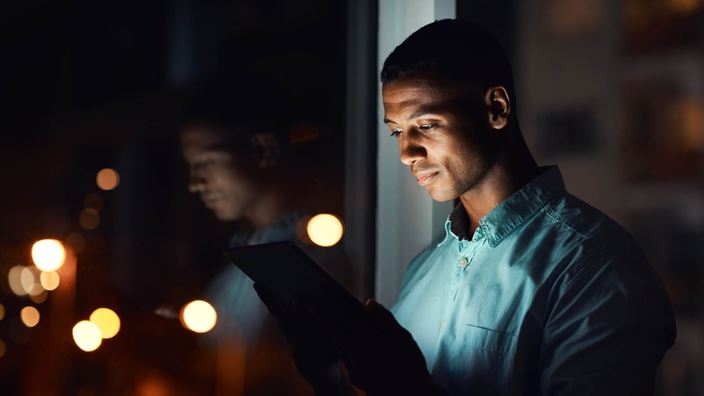 man on phone at night
