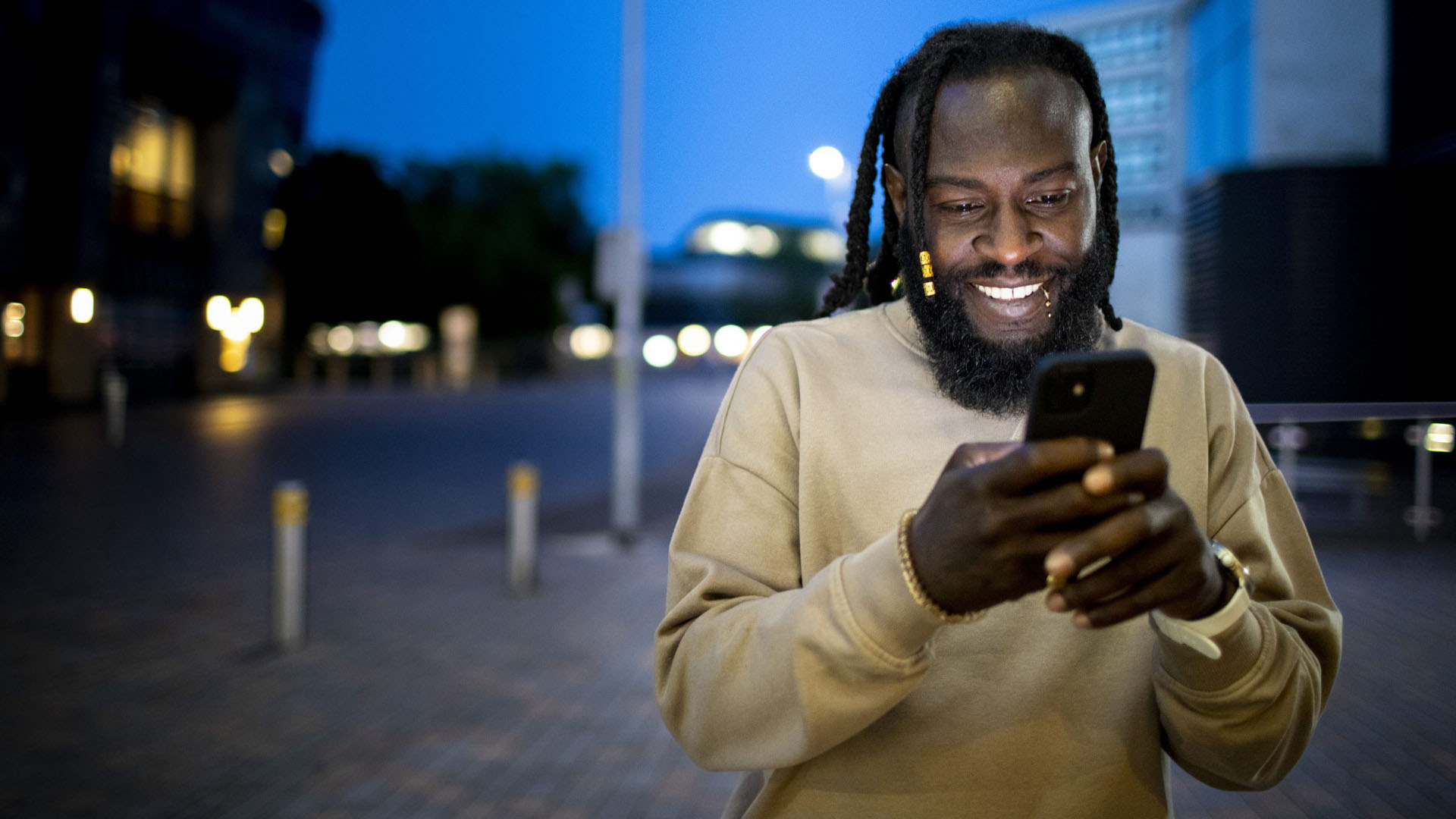 man on phone outside at night