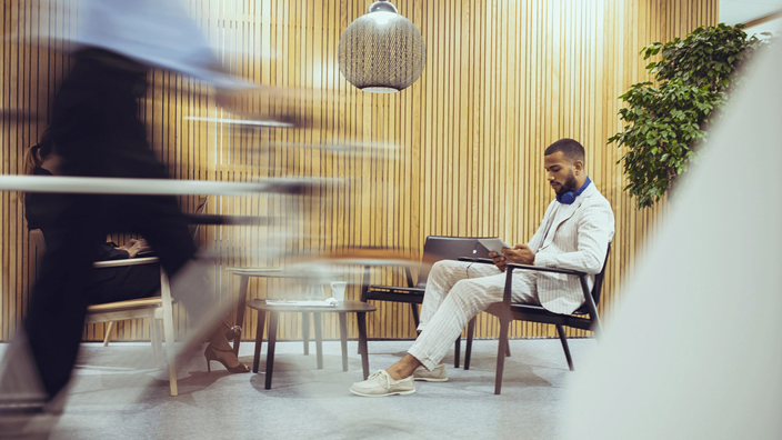 Man-sitting-and-working-in-chair