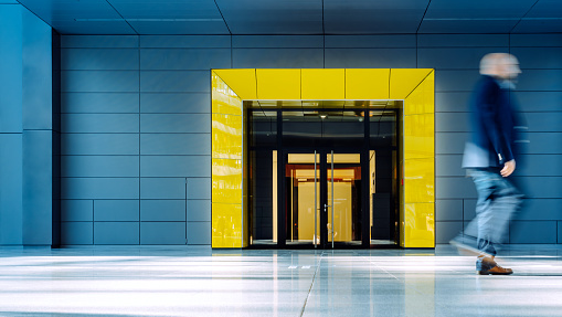 man walking inside a modern building