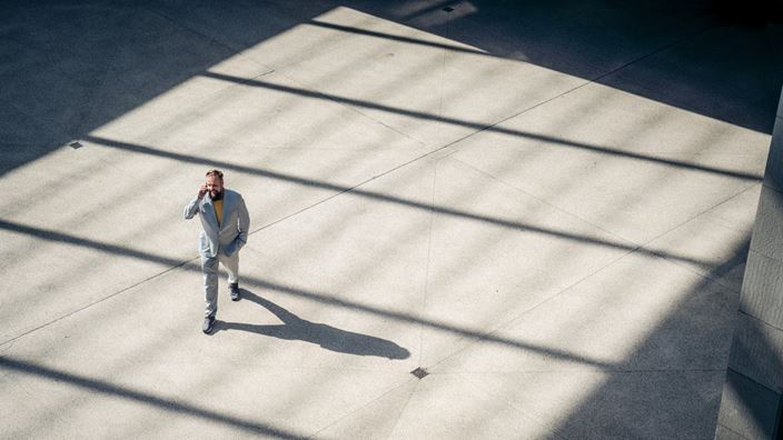 man walking with phone