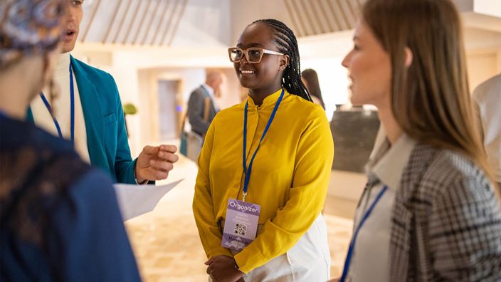 people in group discussion in foyer