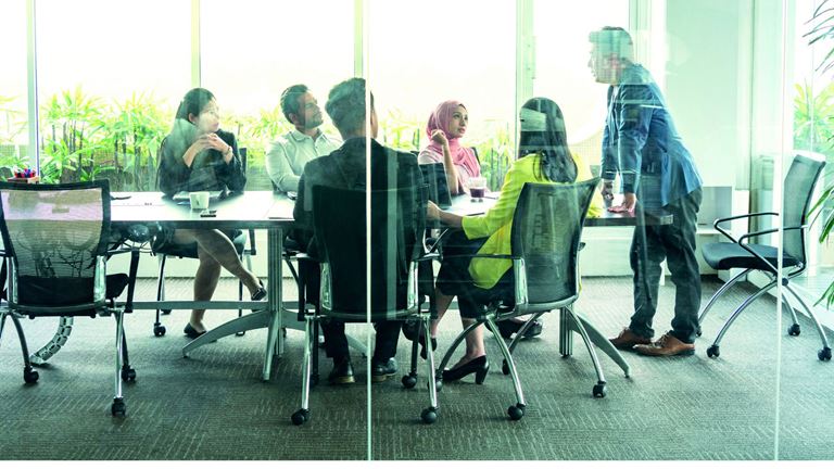 People-in-office-behind-glass-windows