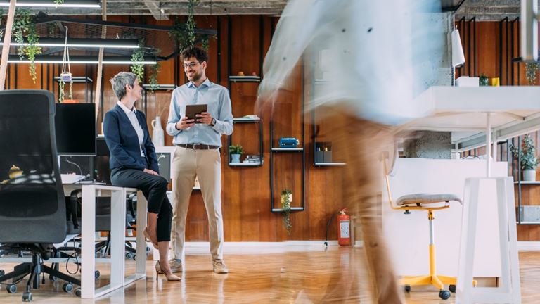 people in the office with desks