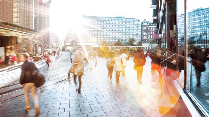 people walking through a busy street