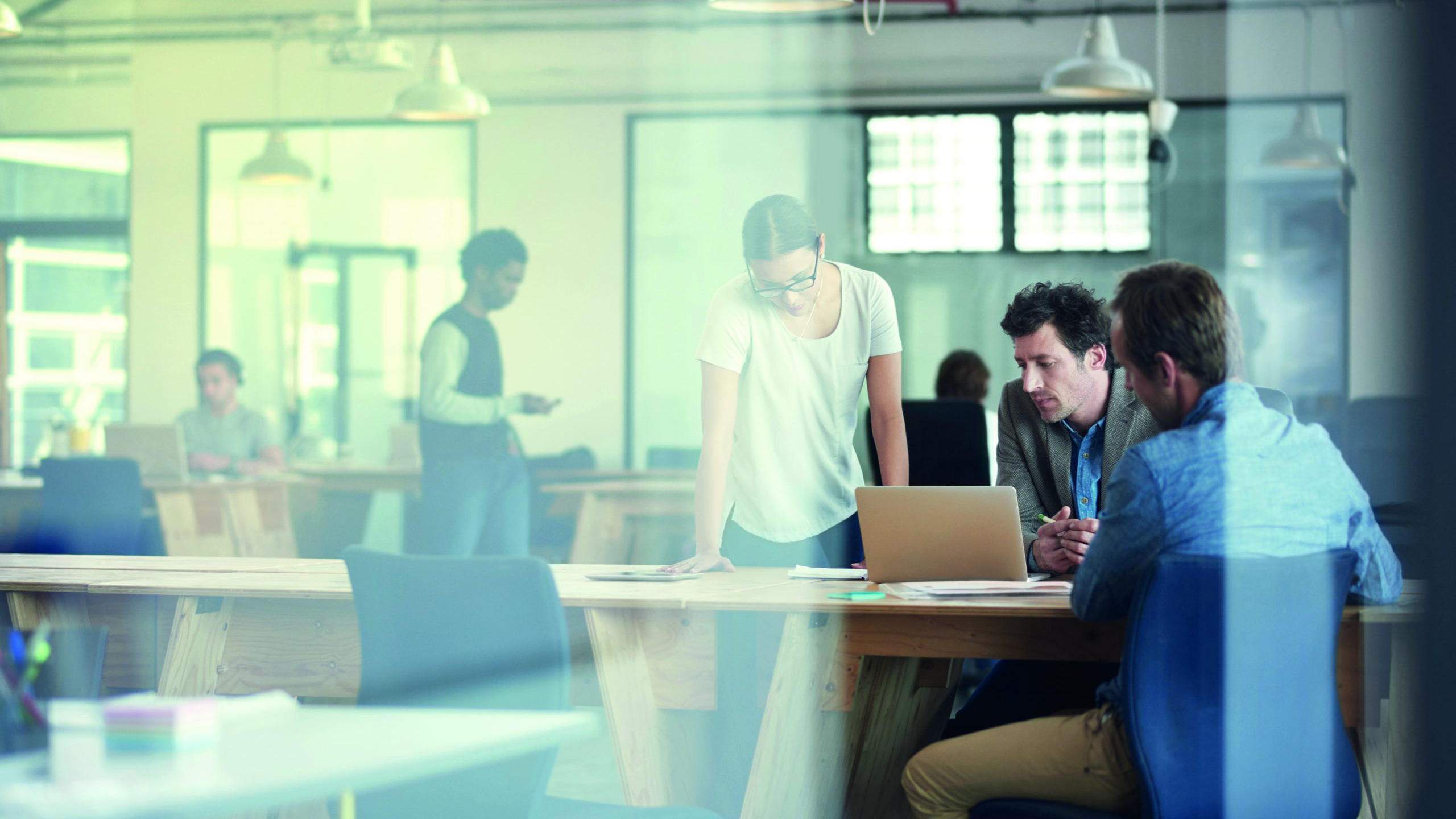 People working and looking at laptop